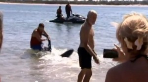 British tourist captures dusky shark pulls it away from frightened people on Bulcock Beach, Australia