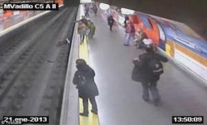 Off-duty officer saves woman who fainted and fell onto train tracks at Madrid subway station