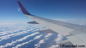 Spectacular view of clouds under a WizzAir wing